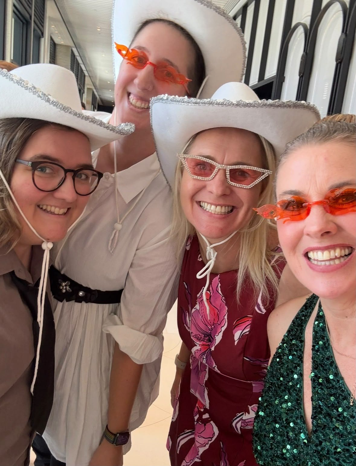 Anne-Marie Grant laughing with friends in a social moment